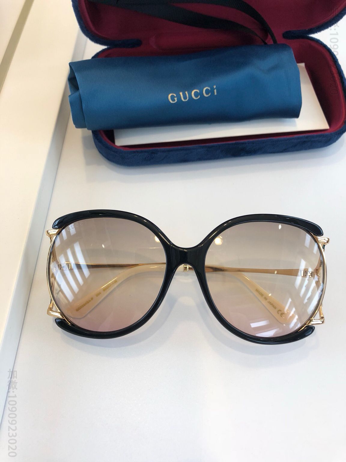 GUCCI古驰女士圆框镂空太阳眼镜