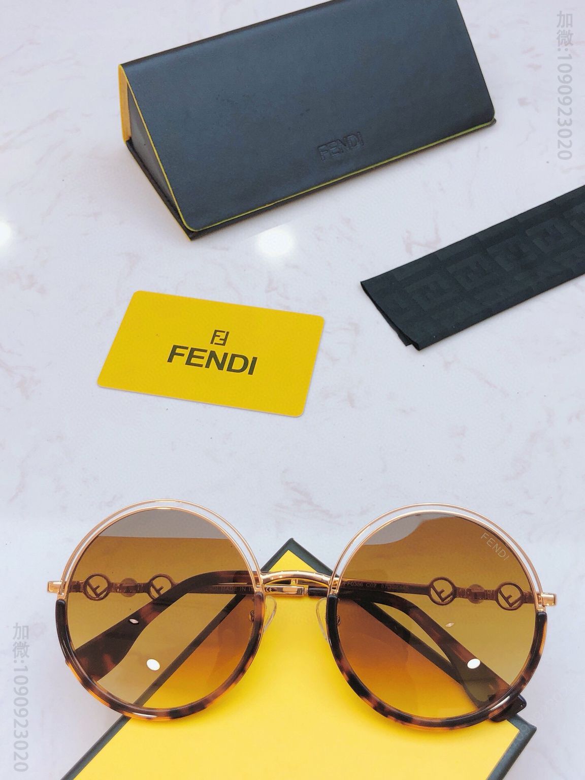 FENDI芬迪镜腿双Logo搭配珍珠圆框女士太阳眼镜